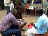 Legal consultation between migrant mineworker and LHR staff in Mozambique